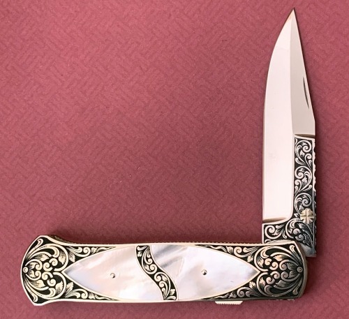 Harvey McBurnette Engraved Pearl Lockback