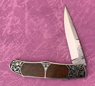 Harvey McBurnette Eagle Nest Engraved Lockback