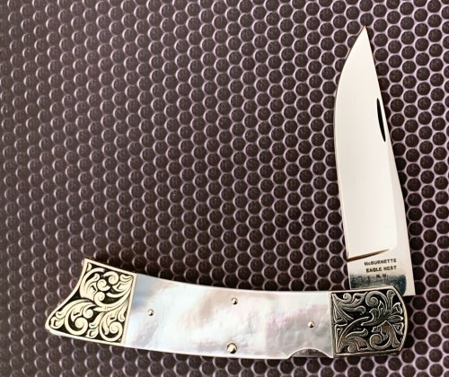 Harvey McBurnette Eagle Nest Engraved Pearl Lockback