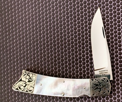 Harvey McBurnette Eagle Nest Engraved Pearl Lockback