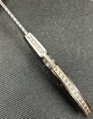 Harvey McBurnette Eagle Nest Engraved Lockback - 3