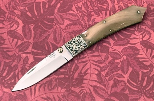 Harvey McBurnette Eagle Nest Engraved Lockback