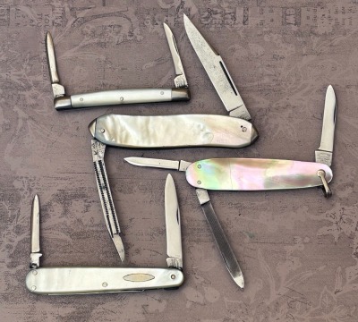 Four Cattaraugus Pearl Folders