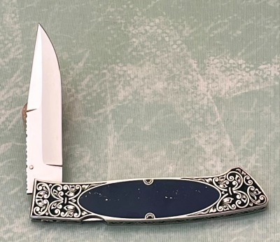 Harvey McBurnette Eagle Nest Engraved Lockback - 2