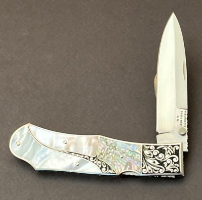 Harvey McBurnette Eagle Nest Pearl and Abalone Engraved Lockback