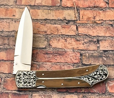 Harvey McBurnette Eagle Nest Mastodon Engraved Lockback - 2