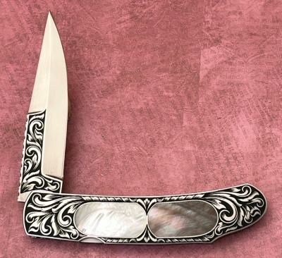 Harvey McBurnette Eagle Nest Engraved Pearl Lockback - 2