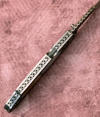 Harvey McBurnette Eagle Nest Engraved Pearl Lockback - 3