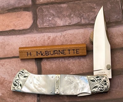 Harvey McBurnette Engraved Pearl Lockback