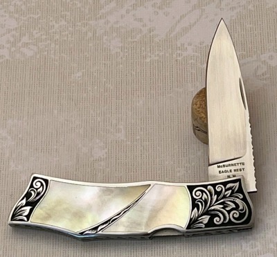 Harvey McBurnette Eagle Nest Pearl Engraved Lockback