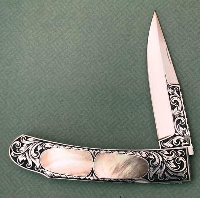 Harvey McBurnette Engraved Pearl Lockback