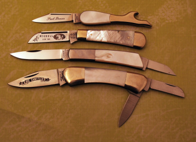 Four 80's pearl handled knives