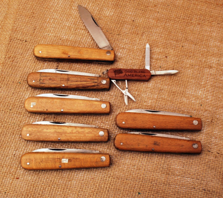 Eight wood handled knives and more