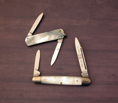 Two etched vintage pearl knives