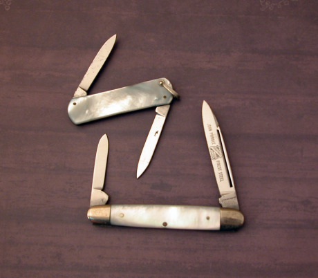 Two etched vintage pearl knives