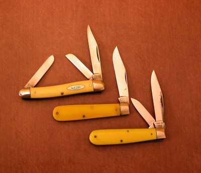 Three vintage yellow handled Case knives