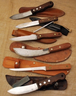 Six wood handled skinning knives