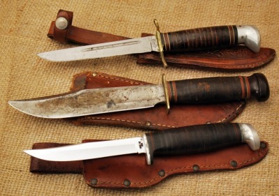 Three leather washer handed knives: Marbles, Western Boulder & Case