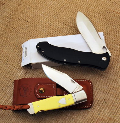 Two A. G. Russell Folders