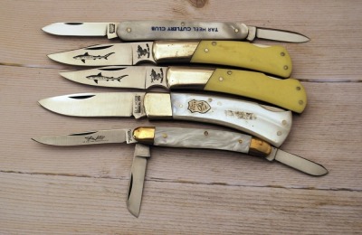 Five synthetic handled knives
