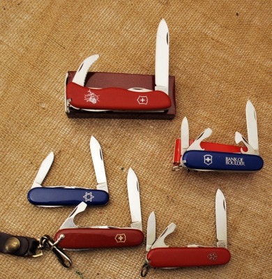Five Swiss Army style knives