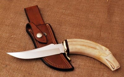 Gary Tucker carved Warthog Tusk hunter