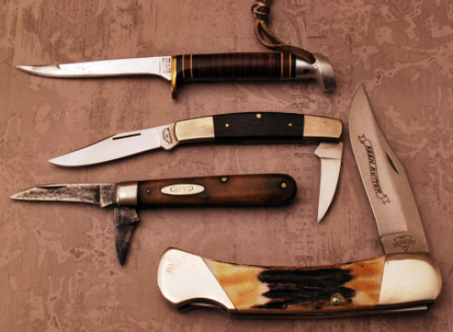 Group of Three folders and one fixed blade