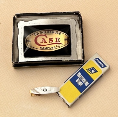 Case Belt Buckle and Tie Clasp and a Norton Sharpening Stone