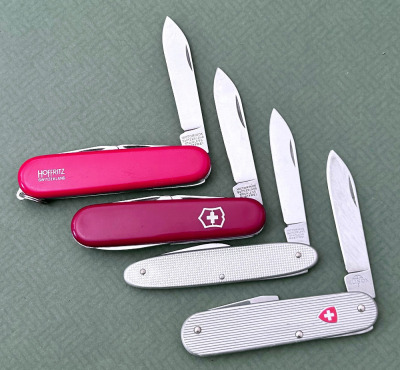 Four Swiss Army knives