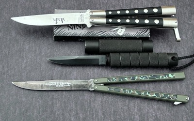 Two Butterfly Knives and a Metal Billy Stick Knife