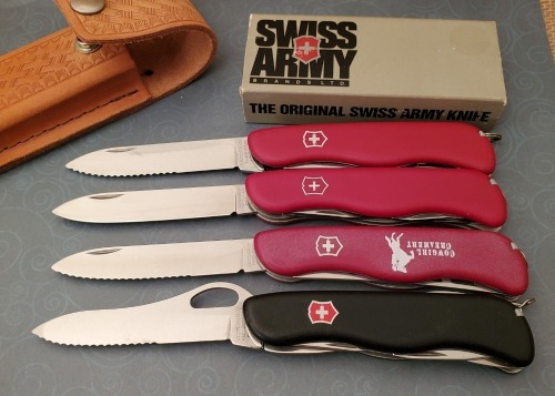 Four Victorinox Swiss Army Knives