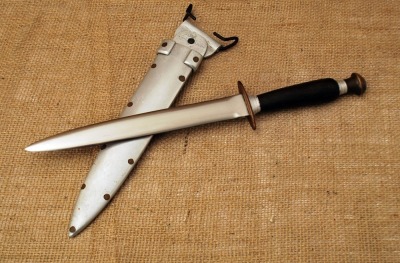 Great all aluminum sheath on this wood handled Theater/Heroes knife