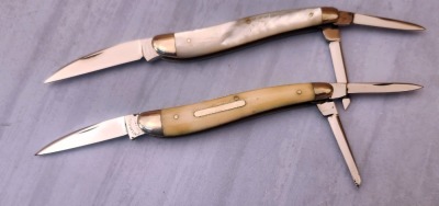 Pair of Cattaraugus Exhibition Wharncliffe Whittlers; One Bone and one Pearl