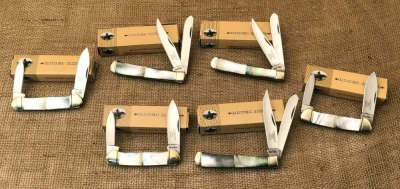 Six Rough Rider Black Lip Pearl; Three Trappers and Three Canoes