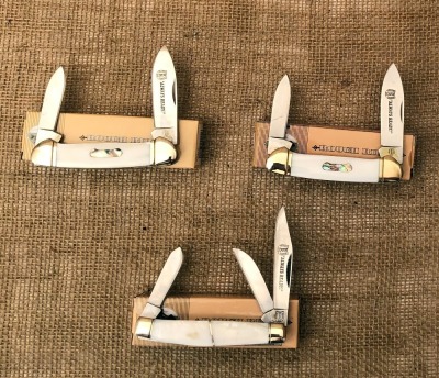 Three Pearl Rough Riders; Two Canoes and one Stockman