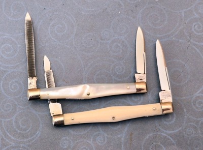 Pair of Cattaraugus Exhibition Swell Center Two Blade, Bone and Pearl