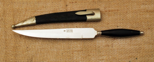 Herder Swell Handled Fixed blade with metal tip and throat sheath.