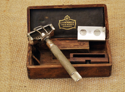 Unusual wood boxed Henckels early safety razor.