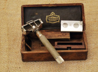 Unusual wood boxed Henckels early safety razor.