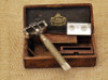 Unusual wood boxed Henckels early safety razor.