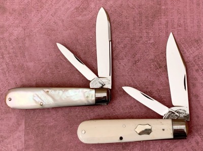 Pair of Cattaraugus Exhibition Pearl and Bone Jacks